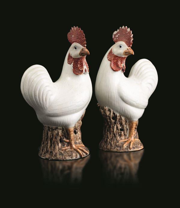 Pair of porcelain rooster figures with white glaze, red glaze crest and neck, China, Qing Dynasty, 18th century