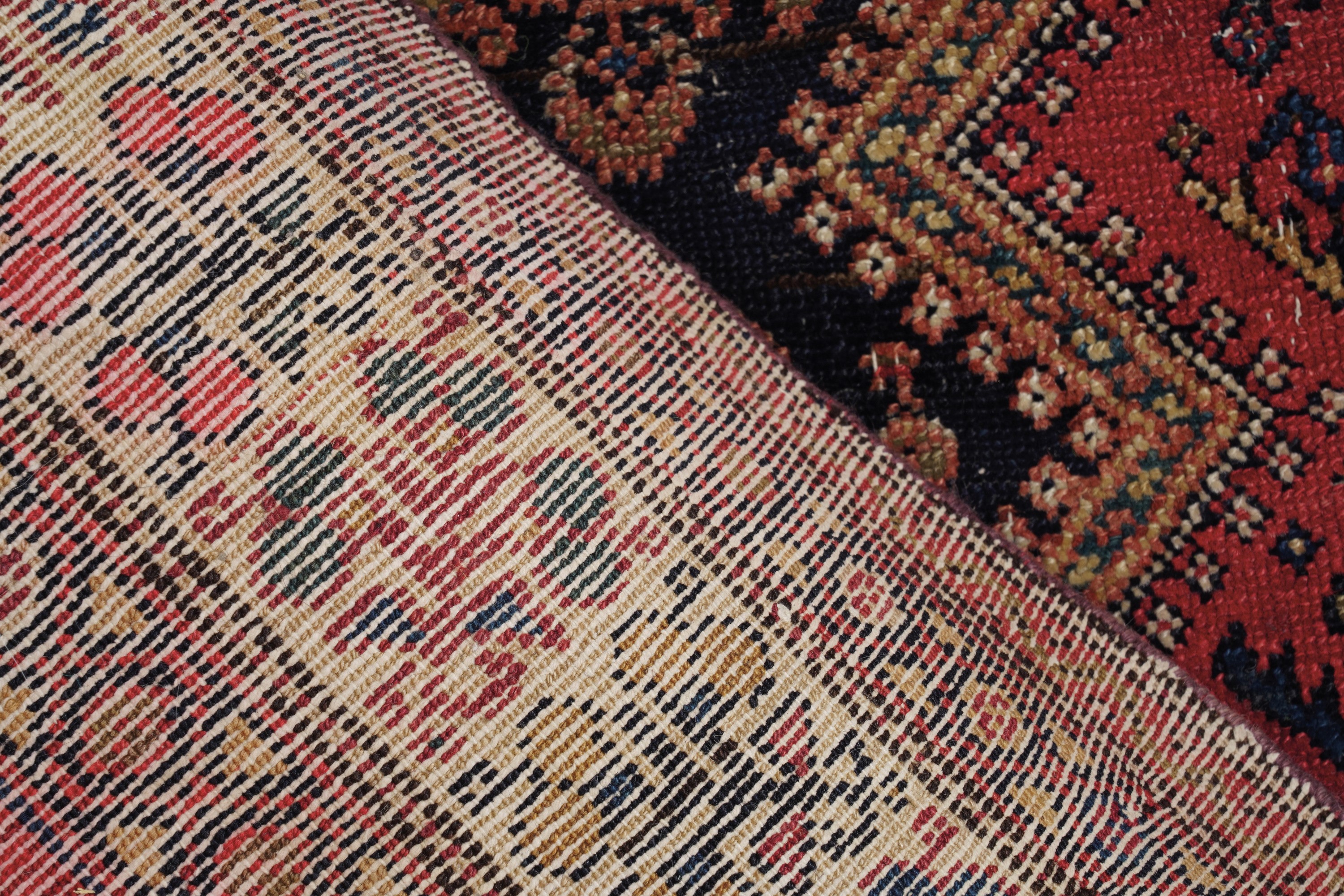 Tappeto Malayer, Persia, inizio XX secolo, cm 280x120, campo blu con decorazioni a bothe