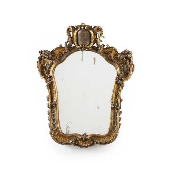 Specchiera in legno intagliato e dorato. XIX secolo