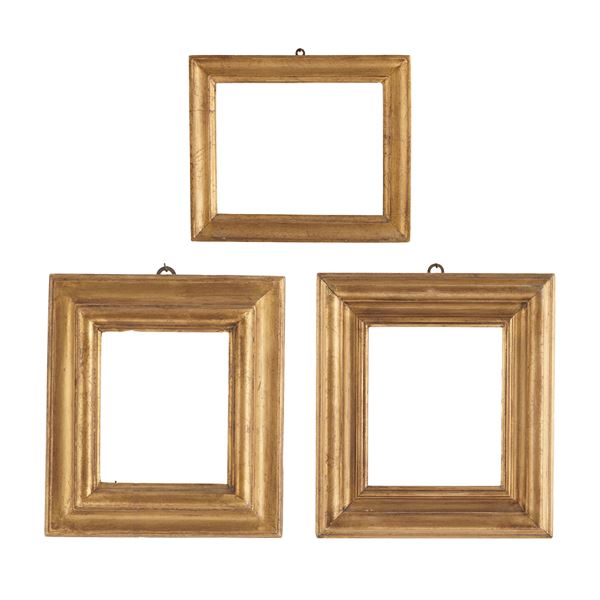 Tre cornici in legno dorato. XX secolo