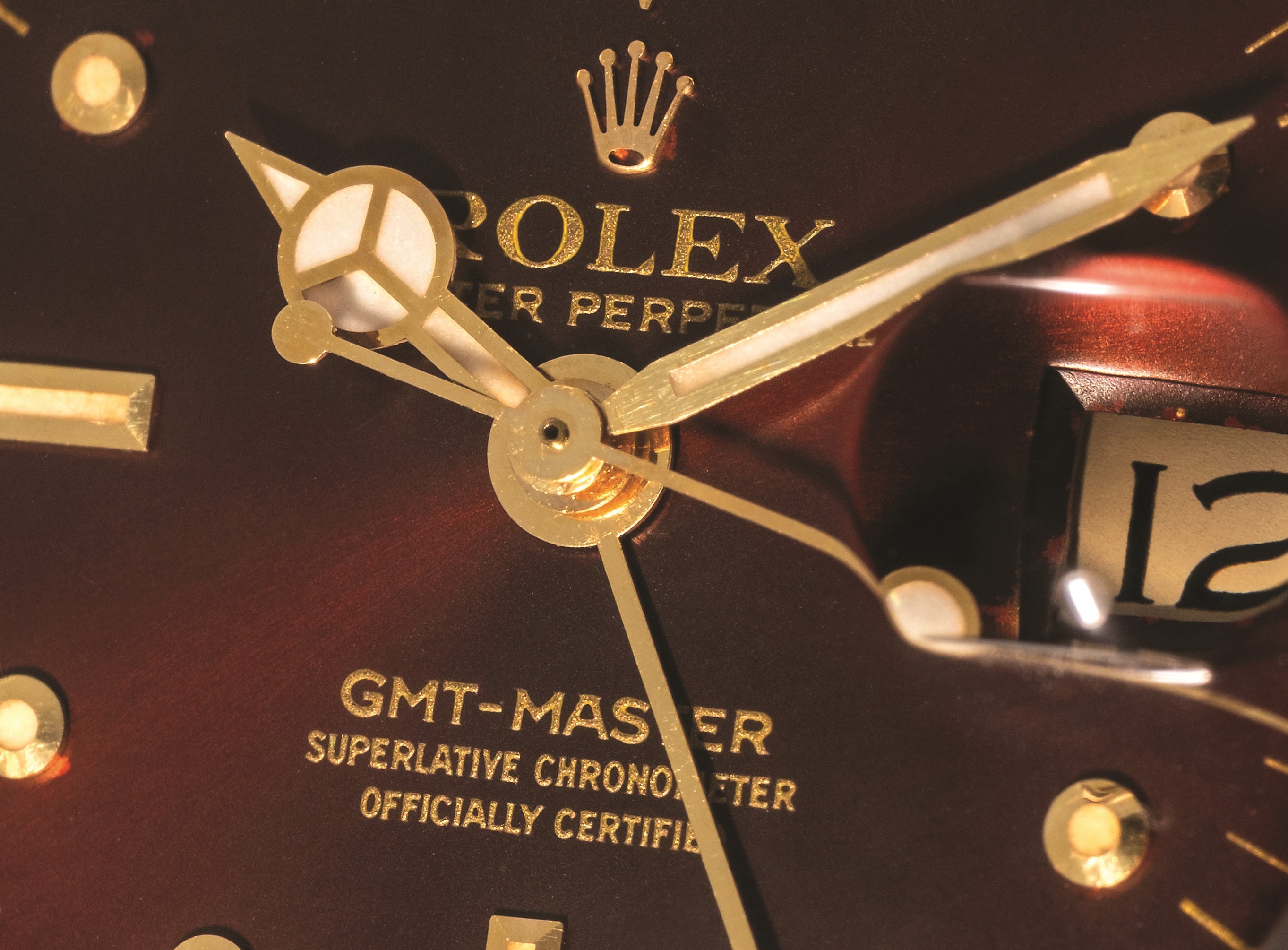 Rolex - GMT Master ref. 1675 in oro giallo 18k, quadrante marrone soleil 'Nipple', circa 1977