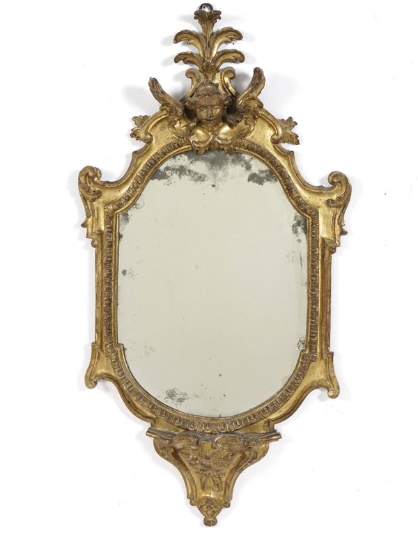 Specchiera in legno scolpito e dorato. XVIII-XIX secolo