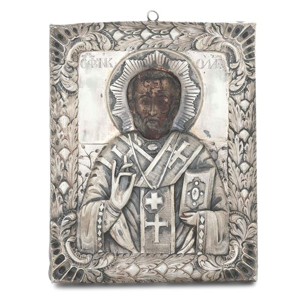 Piccola icona con riza in argento raffigurante San Nicola. Europa dell'est XIX secolo