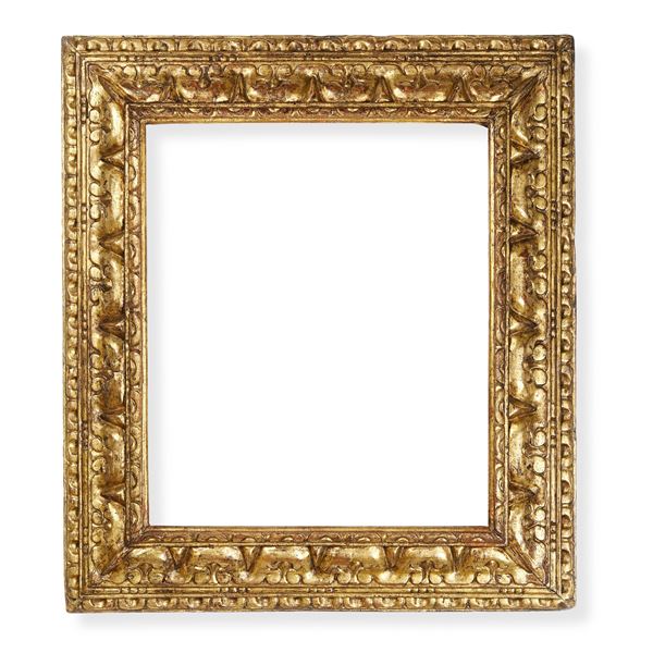 Cornice in legno intagliato e dorato. Emilia XVII secolo