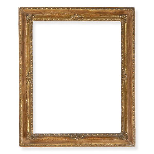 Cornice in legno laccato e dorato con decori in pastiglia. XVIII secolo