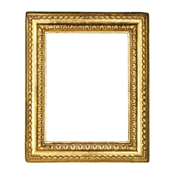Cornice a due ordini di intaglio in legno dorato. XVIII secolo