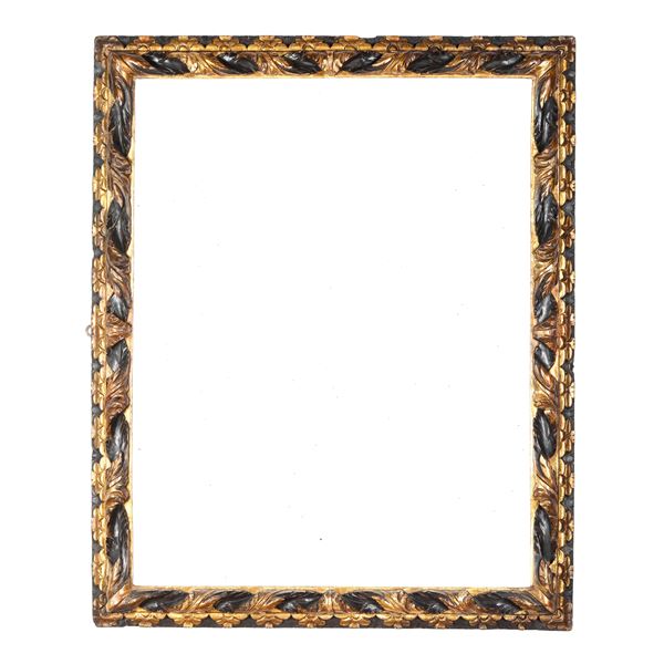 Cornice intagliata, ebanizzata e dorata. Nord Italia XVII secolo