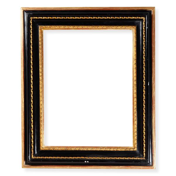 Cornice in legno ebanizzato e dorato. Roma XVII secolo