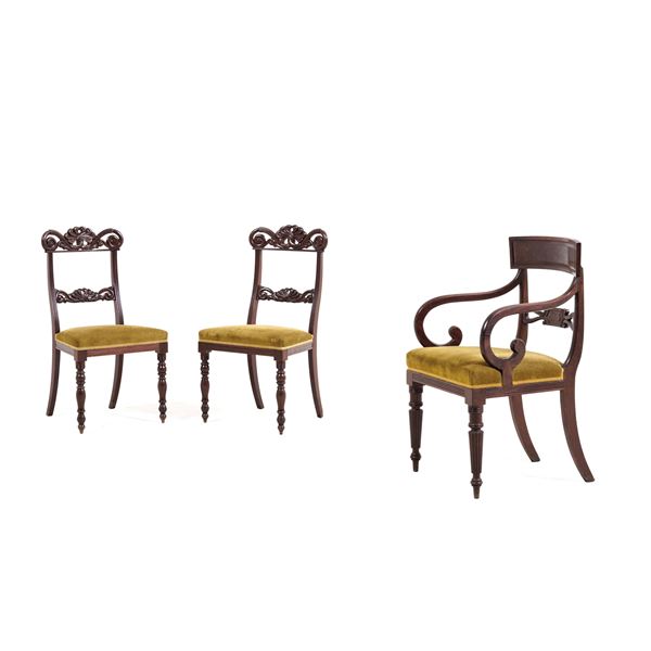 Due sedie e una poltrona in legno intagliato. XIX secolo