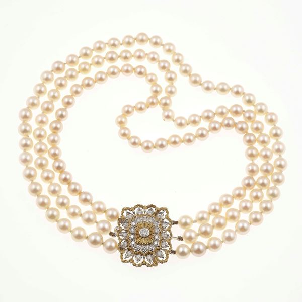 Cultured pearl and gold necklace. Clasp can be worn as a brooch