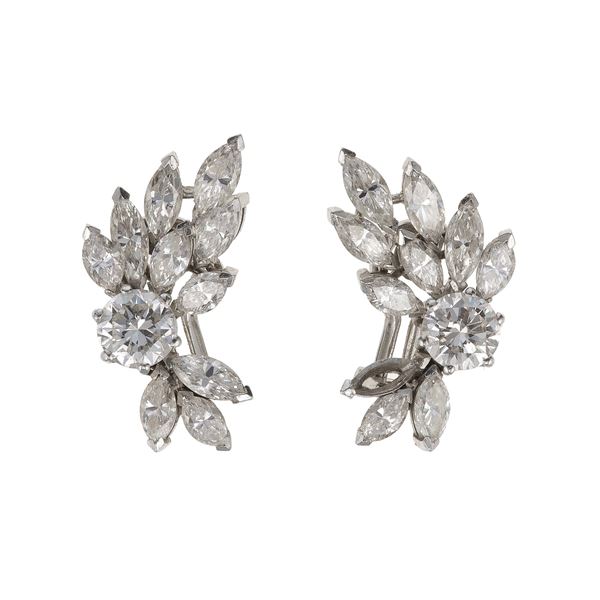 Pair of diamond and platinum earrings. One missing diamond