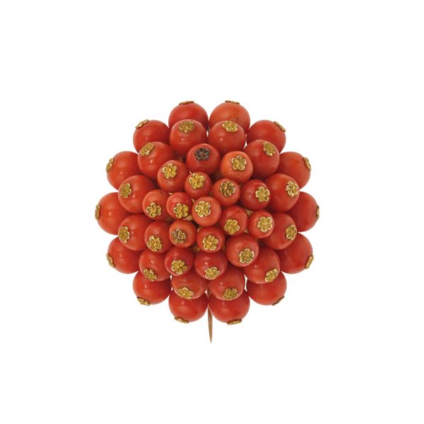 Coral and low-karat gold brooch