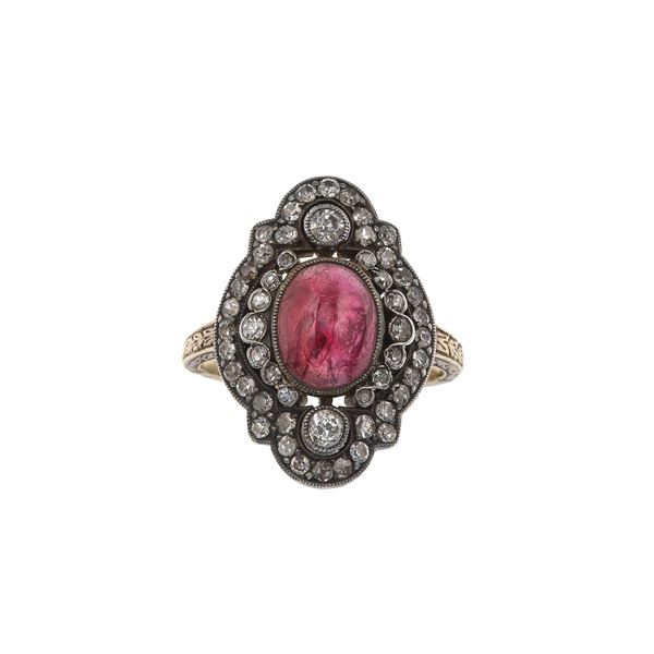 Diamond, cabochon-cut garnet, gold and silver ring