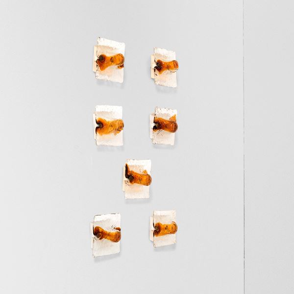 Sette lampade a parete