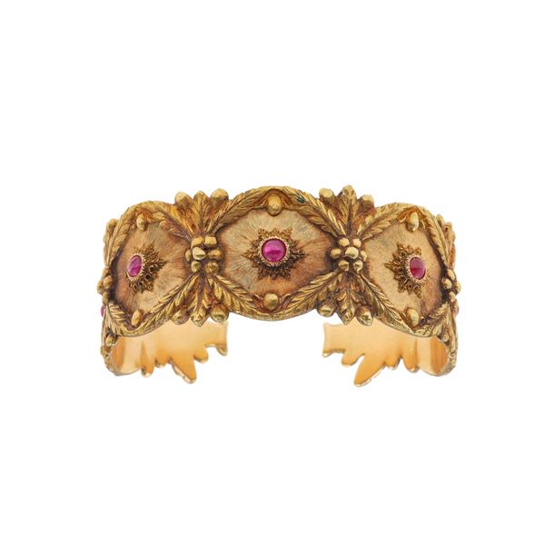 Gold and ruby cuff bracelet. Signed Buccellati