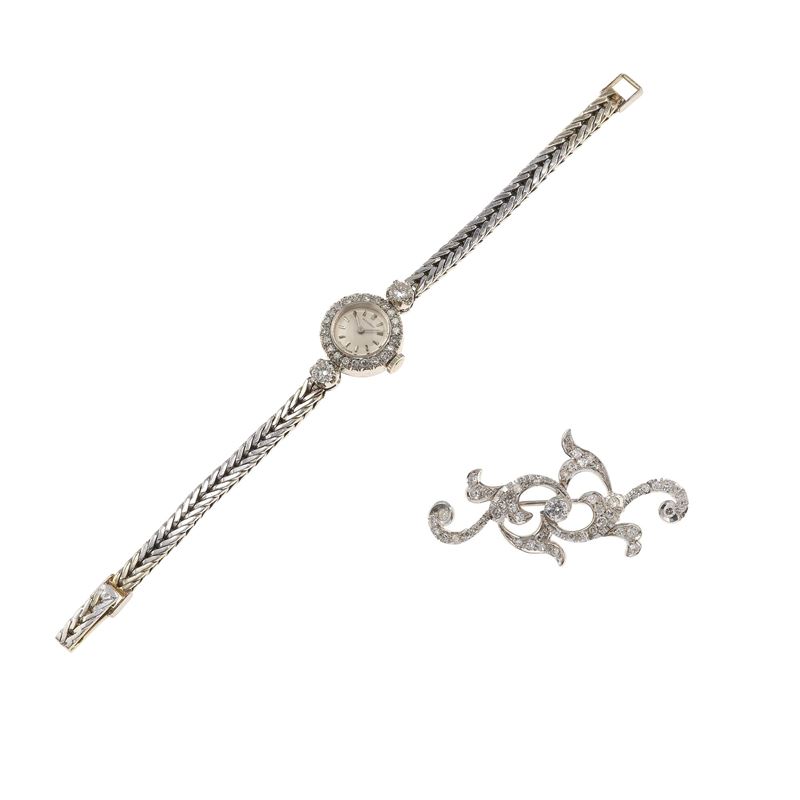 Diamond and gold lady’s wristwatch and brooch. The watch’s movement have not been tested for the accuracy of time and may need a service  - Auction Fine Jewellery - Cambi Casa d'Aste