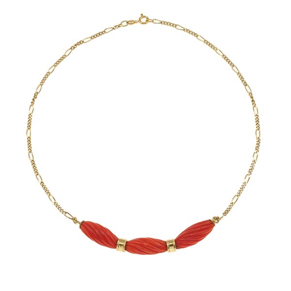Carved coral and gold necklace