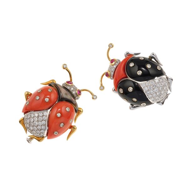 Two coral, onyx and gold clip brooches