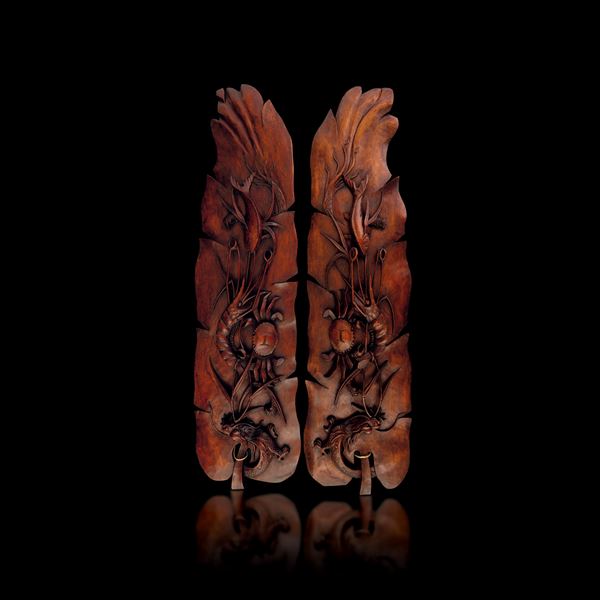 Pair of wooden panels with naturalistic relief motifs, China, Qing Dynasty, 19th century