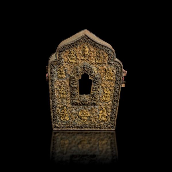 Gilded copper travel altar with plant decorations and figures in relief, Tibet, 18th century