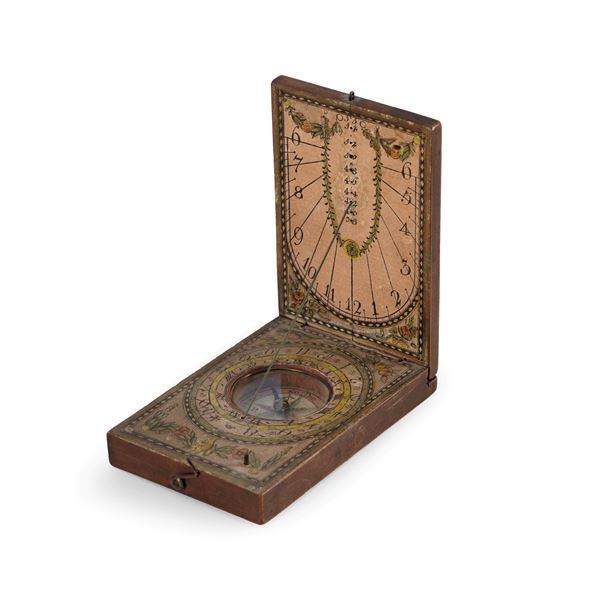 Orologio solare dittico da viaggio in legno e carta dipinta. Firmato P.B, Germania XVIII secolo