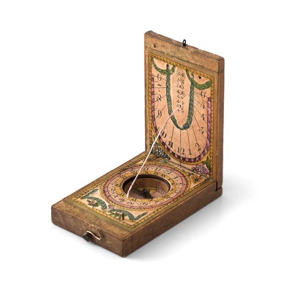 Orologio solare dittico da viaggio in legno e carta dipinta. XVIII secolo