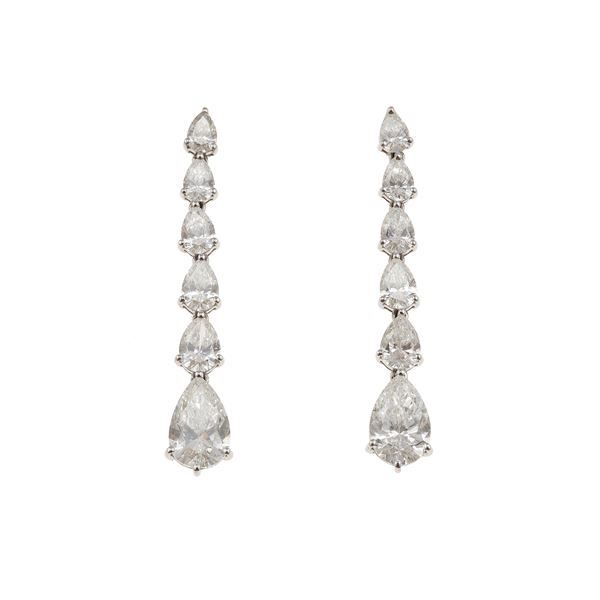 Pair of pear-cut diamond and gold earrings