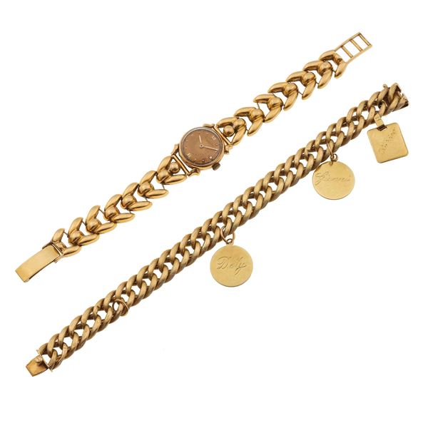 Lotto composto da un bracciale con tre medaglie ed un orologio da polso Baume & Mercier