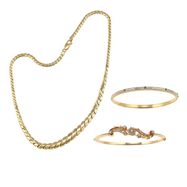 Two gold and silver bracelets and one gold necklace