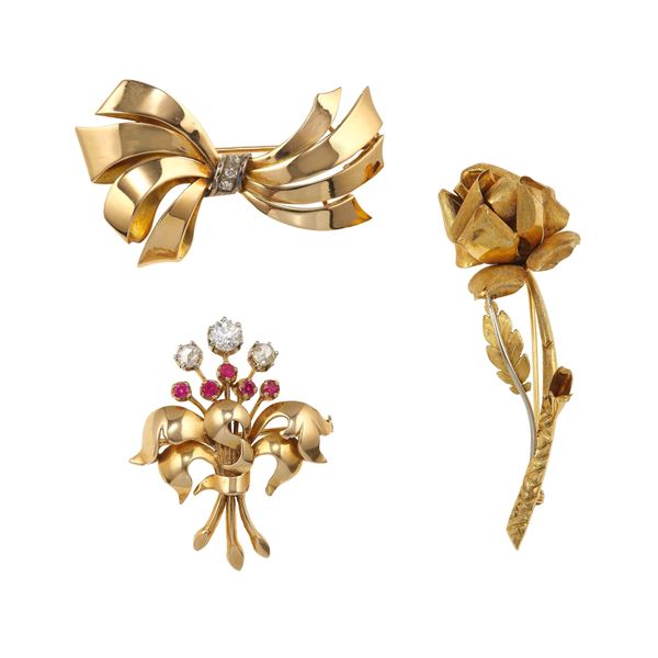 Three gold brooches
