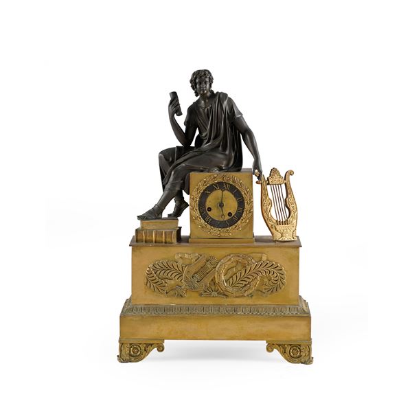 Pendola da tavolo in bronzo dorato e patinato. Francia XIX secolo