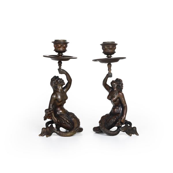 Coppia  di candelieri a foggia di tritoni. Arte del XIX-XX secolo,  firmati: "A. Pandiani Milano"