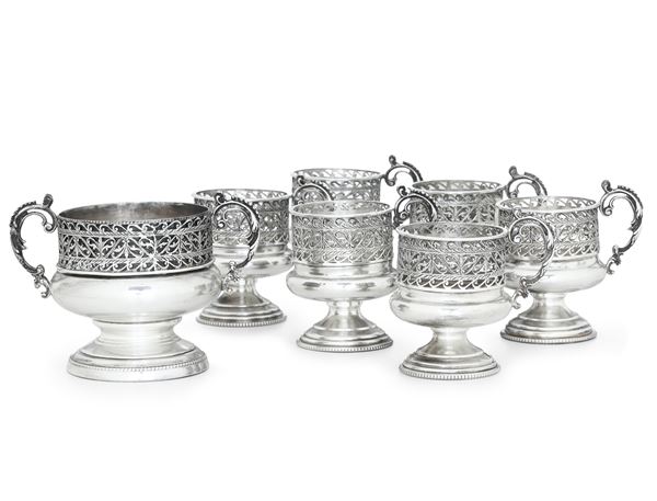 Lotto composto da sei porta tazze ed un porta zuccheriera. Argenteria milanese della prima metà del XX secolo, argentiere Carmelo Ganci