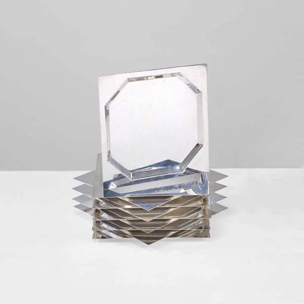 Dieci sottopiatti in argento 925.