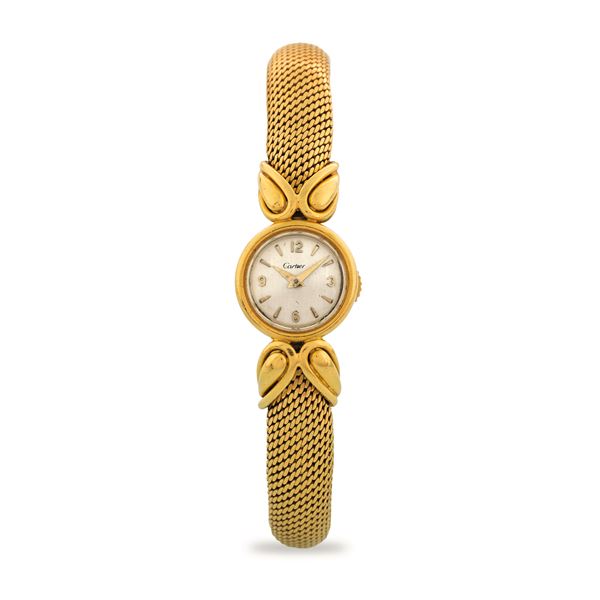 Cartier - Elegant 18k yellow gold wristwatch with integrated bracelet and drop decoration, silver-plated dial, circa 1950