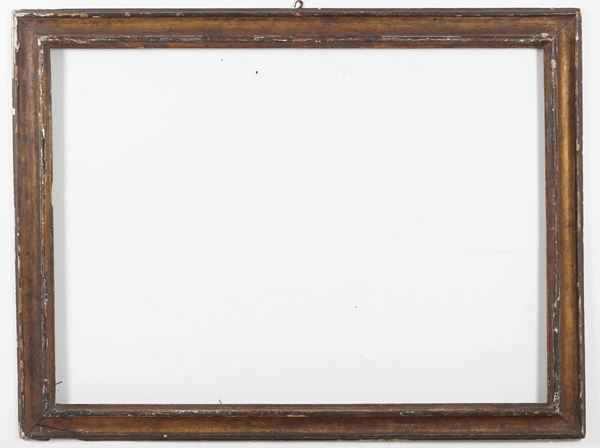 Grande cornice in legno intagliato. XVII secolo