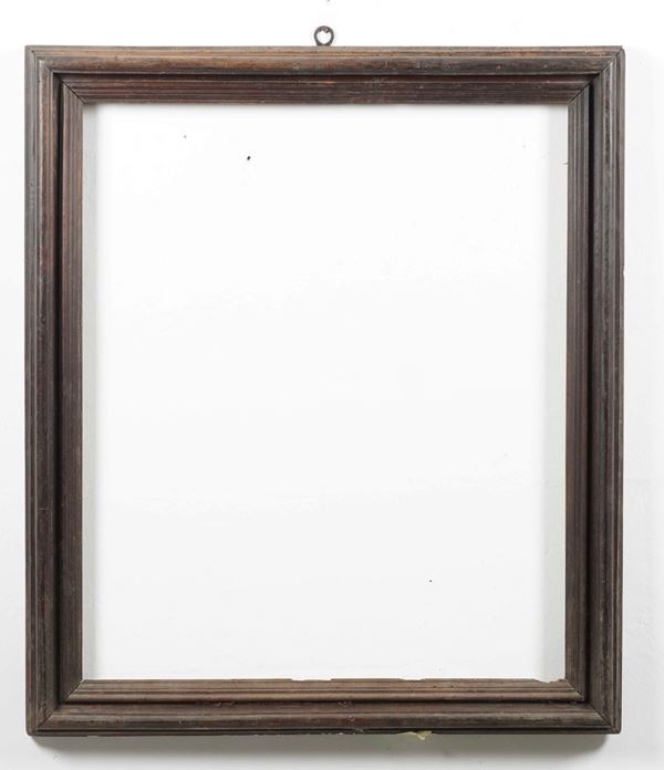 Cornice in legno intagliato. XVII secolo