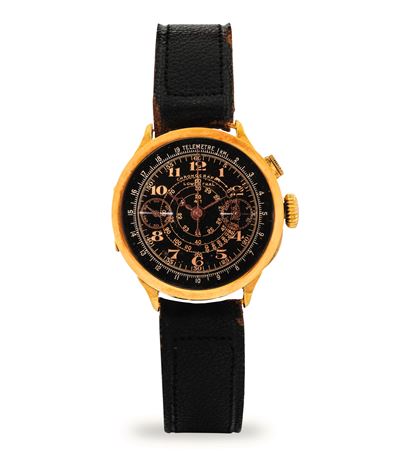 Cronografo mono-rattrapante in oro giallo 18k con quadrante nero e scala tachimetrica, circa 1930