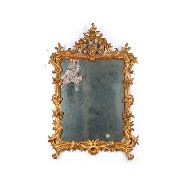 Specchiera in legno intagliato e dorato. XIX secolo