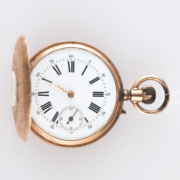 Demi-Savonette in oro rosa 12k con cassa decorata, quadrante smalto bianco con numeri Romani e piccoli secondi al sei, carica remontoir<BR>42 mm, peso 53,4 g<BR><BR>