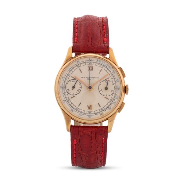 Cronografo in oro giallo 18k con tasti rettangolari, quadrante argentè con numeri Romani e indici applicati e contatori al tre e al nove, carica manuale, 34 mm