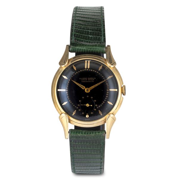 Dress Watch in oro giallo 14k con anse Cornes de Vache, quadrante nero con piccoli secondi al sei, carica  [..]