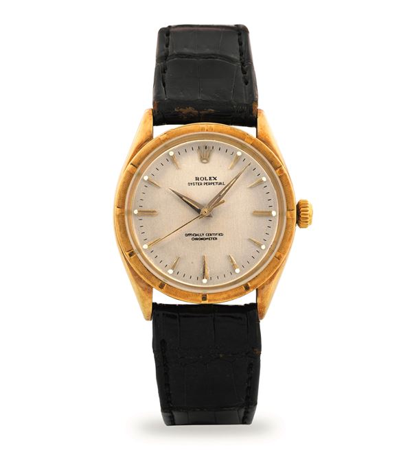 Rolex - Oyster Perpetual ref 6569 in 14k yellow gold, silvered dial, circa 1958