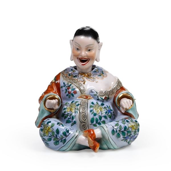 Figura di magot con mani, testa e lingua mobili. XX secolo.