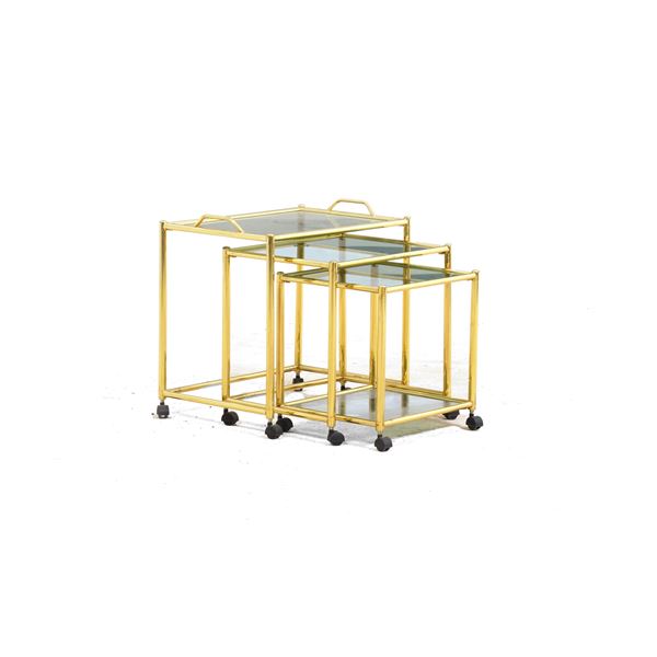 Tre tavolini a nido in ottone. XX secolo