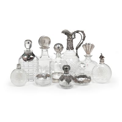Brocca e nove bottiglie, vetro con elementi in argento, di diversa epoca e manifattura