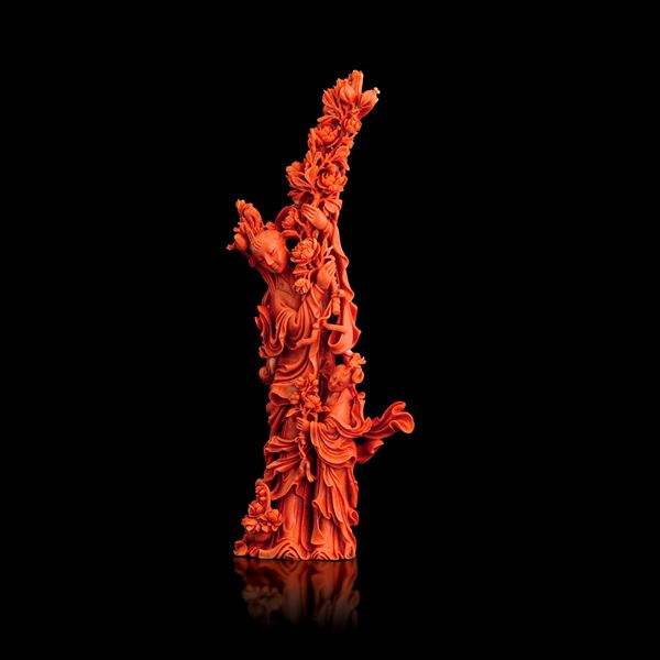 Figure of Guanyin holding flowers and a maiden carved in red coral, China, Qing Dynasty, 19th century
