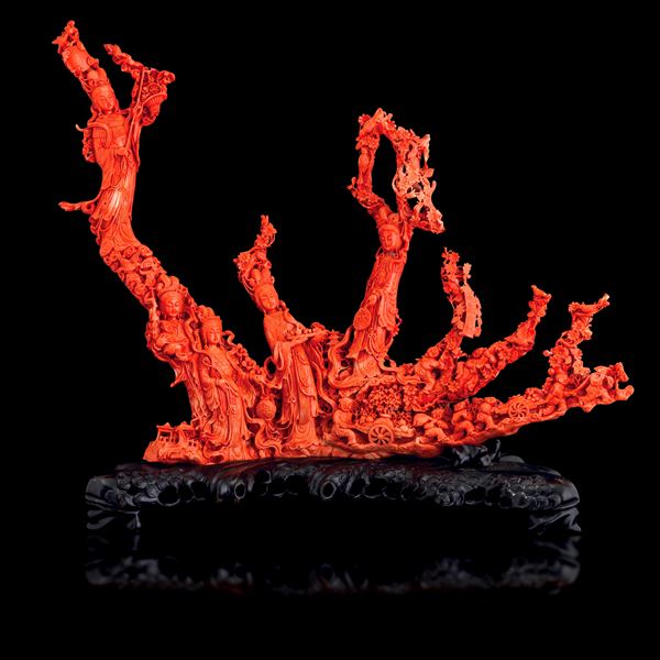 Important and monumental red coral carving depicting Guanyin, maidens, and vegetation with inscriptions, China, Qing Dynasty, 19th century