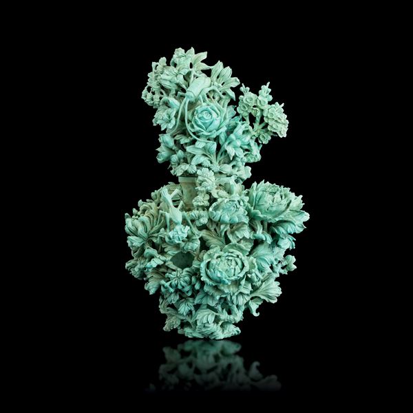 Turquoise vase carved with raised floral motifs, China, 20th century