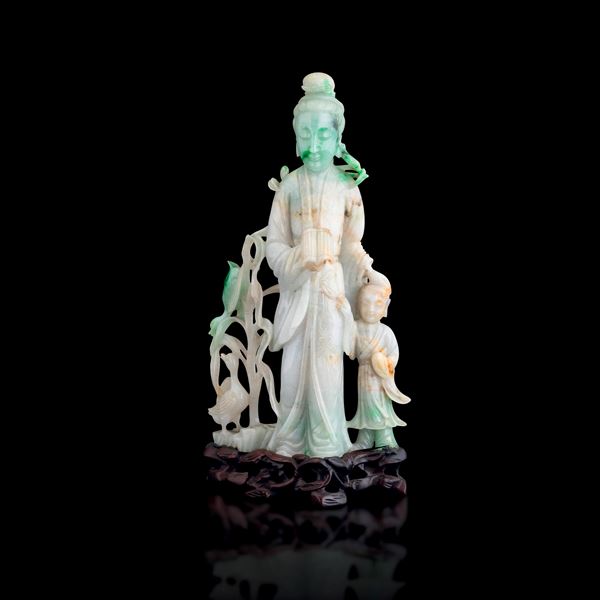 Jadeite figure depicting a woman with a child and a duck, with vegetal decorations and apple green hues, China, Qing Dynasty, 19th century
